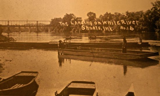 Flat-bottomed mussel gathering boat in White River at Shoals, Indiana (c1920s)